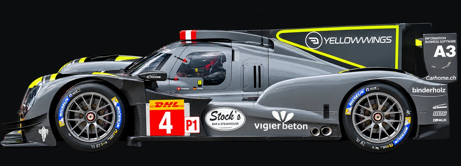 Seitenansicht von links auf einen grau lackierten LMP1-Rennwagen mit neongelben Akzenten an Nase, Schweller und Heckflügel